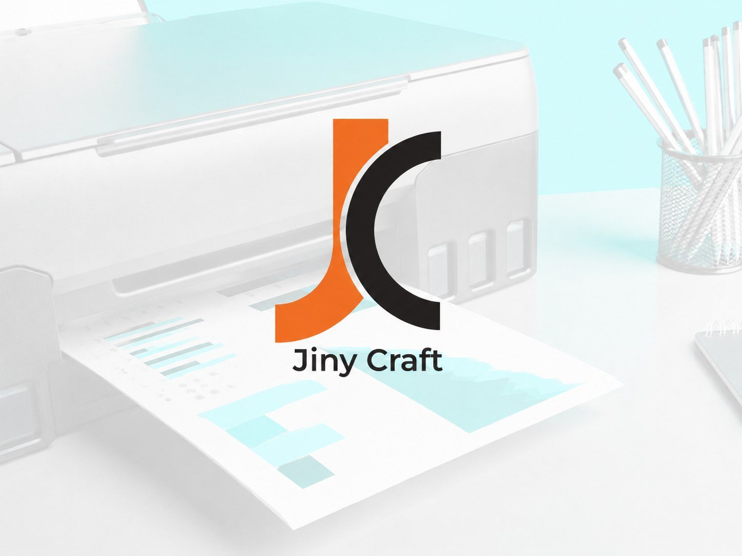 Jiny Craft designers collaborating over brand mockups and printed samples